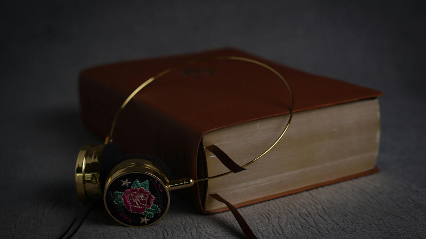 Headphones resting on a book