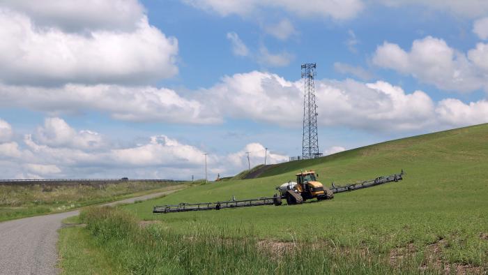 To provide cell phone services in rural areas between larger towns telecommunication companies install towers on hilltops or high ridges in rural areas. This tower is in rural Whitman County Washington adjacent to where a farmer is growing a crop. (Photo by: Don and Melinda Crawford/UCG/Universal Images Group via Getty Images)