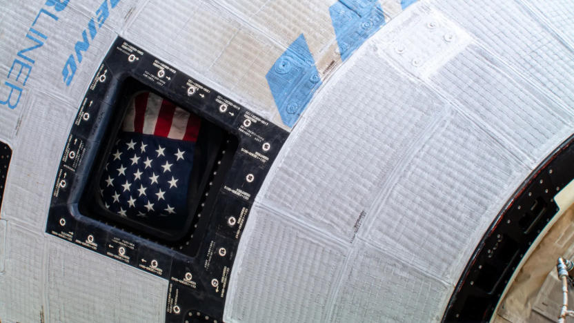 Closeup of a space capsule with the flag of the United States.