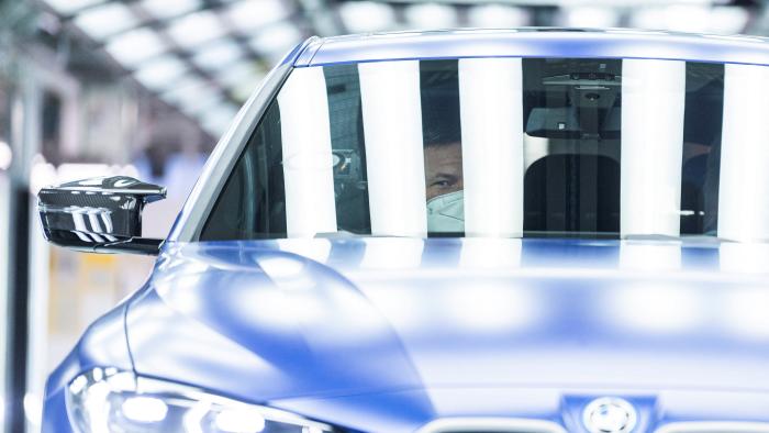 German Economic and Climate Protection Minister Robert Habeck gets driven in a BMW i4 electric car during his visit at the BMW plant in Munich, Germany, January 20, 2022. REUTERS/Lukas Barth