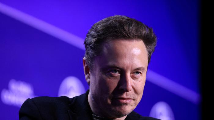 FILE PHOTO: Elon Musk, Chief Executive Officer of SpaceX and Tesla and owner of X looks on during the Milken Conference 2024 Global Conference Sessions at The Beverly Hilton in Beverly Hills, California, U.S., May 6, 2024.  REUTERS/David Swanson/File Photo