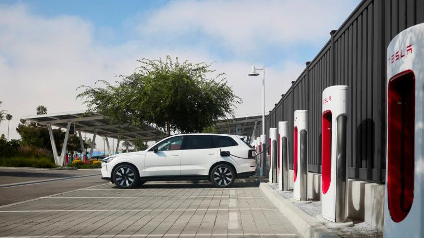 A Volvo EV charging at a Tesla Supercharger